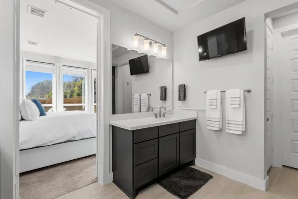 a bathroom with a double vanity sink mirror and double