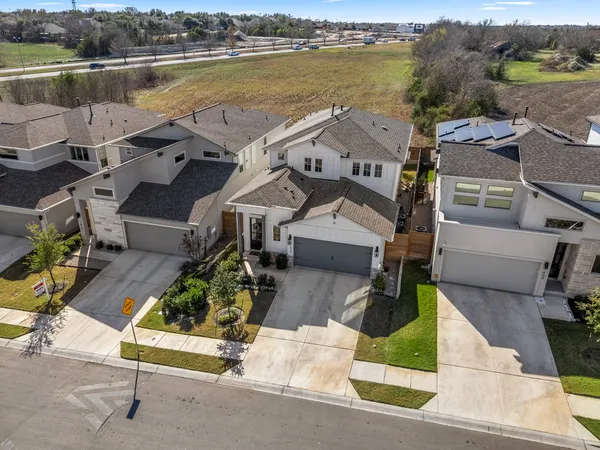 an aerial view of a house with lake view