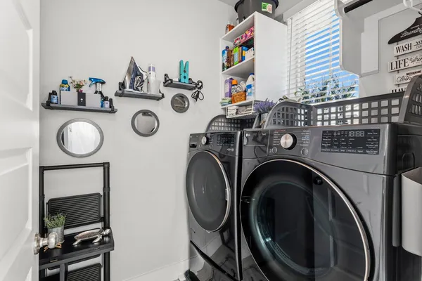 a view of washer and dryer in a utility room