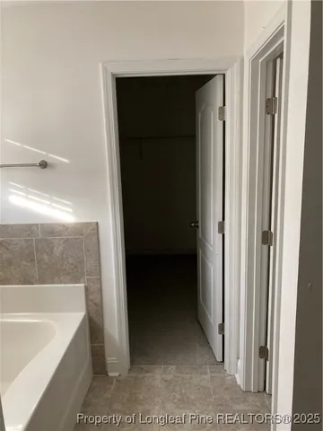 a bathroom with a sink a mirror and shower