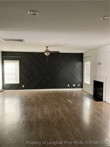 a view of an empty room and fire place