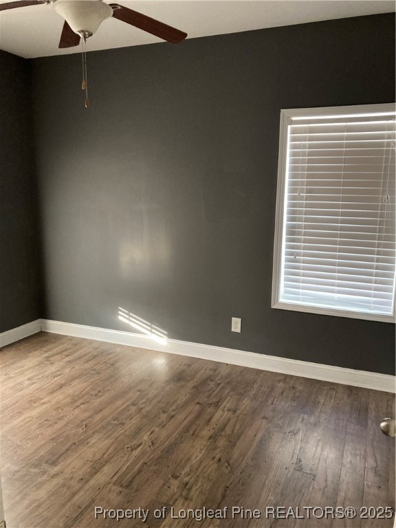 270 Stonebriar Avenue Raeford, NC 28376 - Photo 8 of 26 a view of an empty room with wooden floor and a window