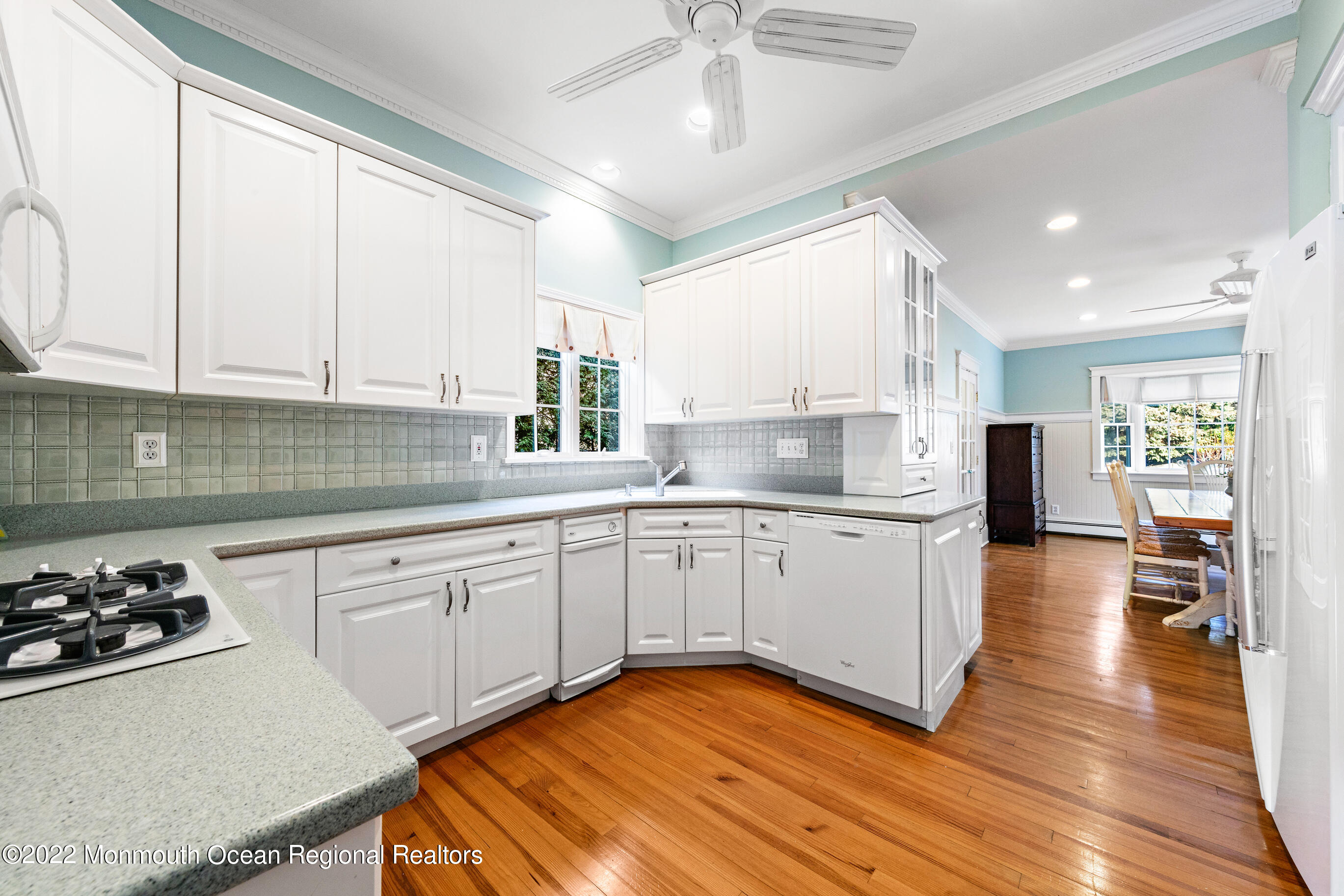 116 Tuttle Avenue Spring Lake, NJ 07762 - Photo 16 of 45 a kitchen with stainless steel appliances granite countertop a stove a sink dishwasher and a refrigerator with white cabinets