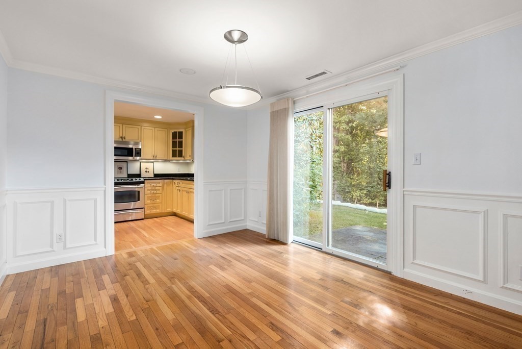 79 Jericho Road, Unit 79 Weston, MA 02493 - Photo 6 of 16 a view of a kitchen with wooden floor and a window