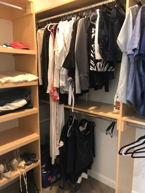 74130 Pele Place Palm Desert, CA 92211 - Photo 12 of 19 a view of walk in closet with clothes and shoes