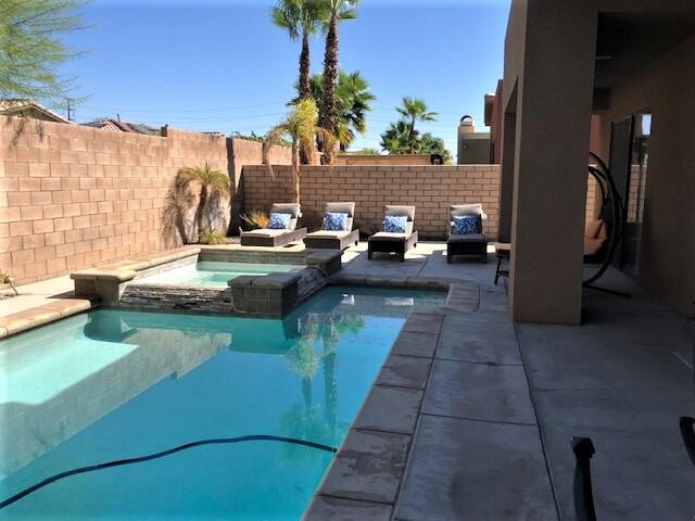 74130 Pele Place Palm Desert, CA 92211 - Photo 17 of 19 a view of a patio with couches and potted plants