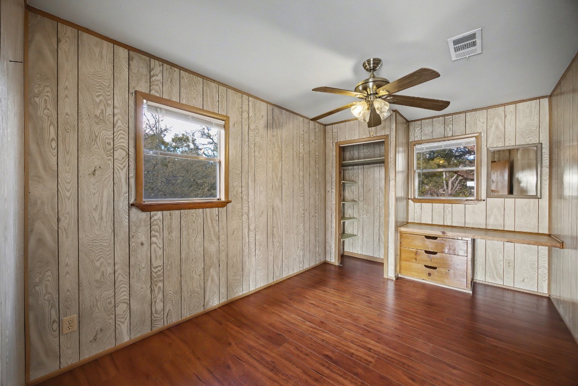 17019 Rocky Ridge Road Austin, TX 78734 - Photo 17 of 37 wooden floor in an empty room with a window