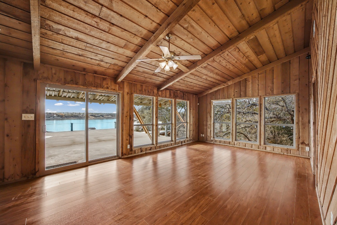 17019 Rocky Ridge Road Austin, TX 78734 - Photo 9 of 37 a view of an empty room with wooden floor and a window