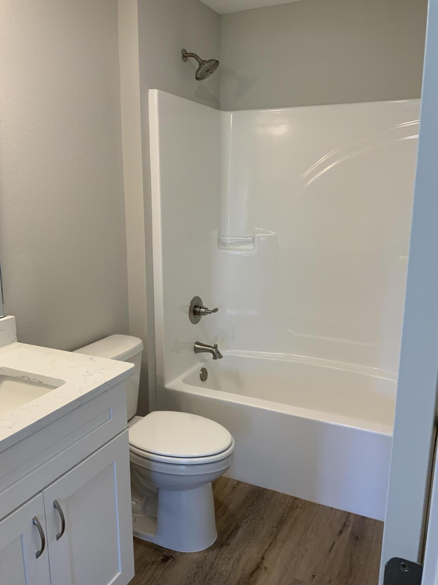 200 South Norwood Road DeFuniak Springs, FL 32435 - Photo 7 of 7 a bathroom with a toilet a sink and a bathtub