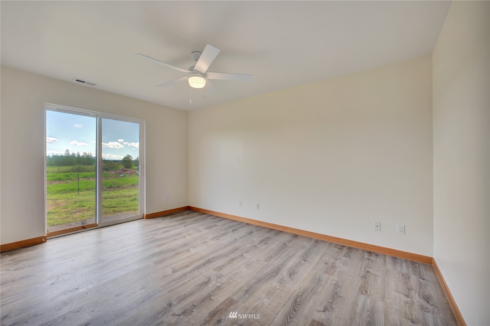 12112 Roosevelt Road Snohomish, WA 98290 - Photo 13 of 36 wooden floor in an empty room with a window