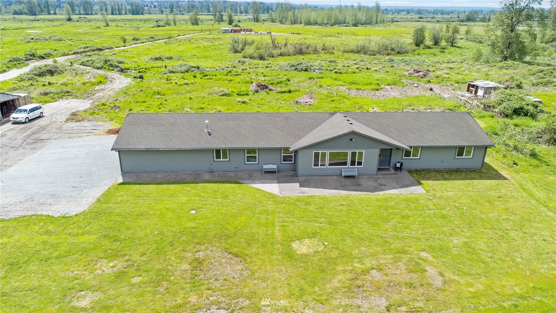 12112 Roosevelt Road Snohomish, WA 98290 - Photo 5 of 36 a house view with a swimming pool and outdoor space