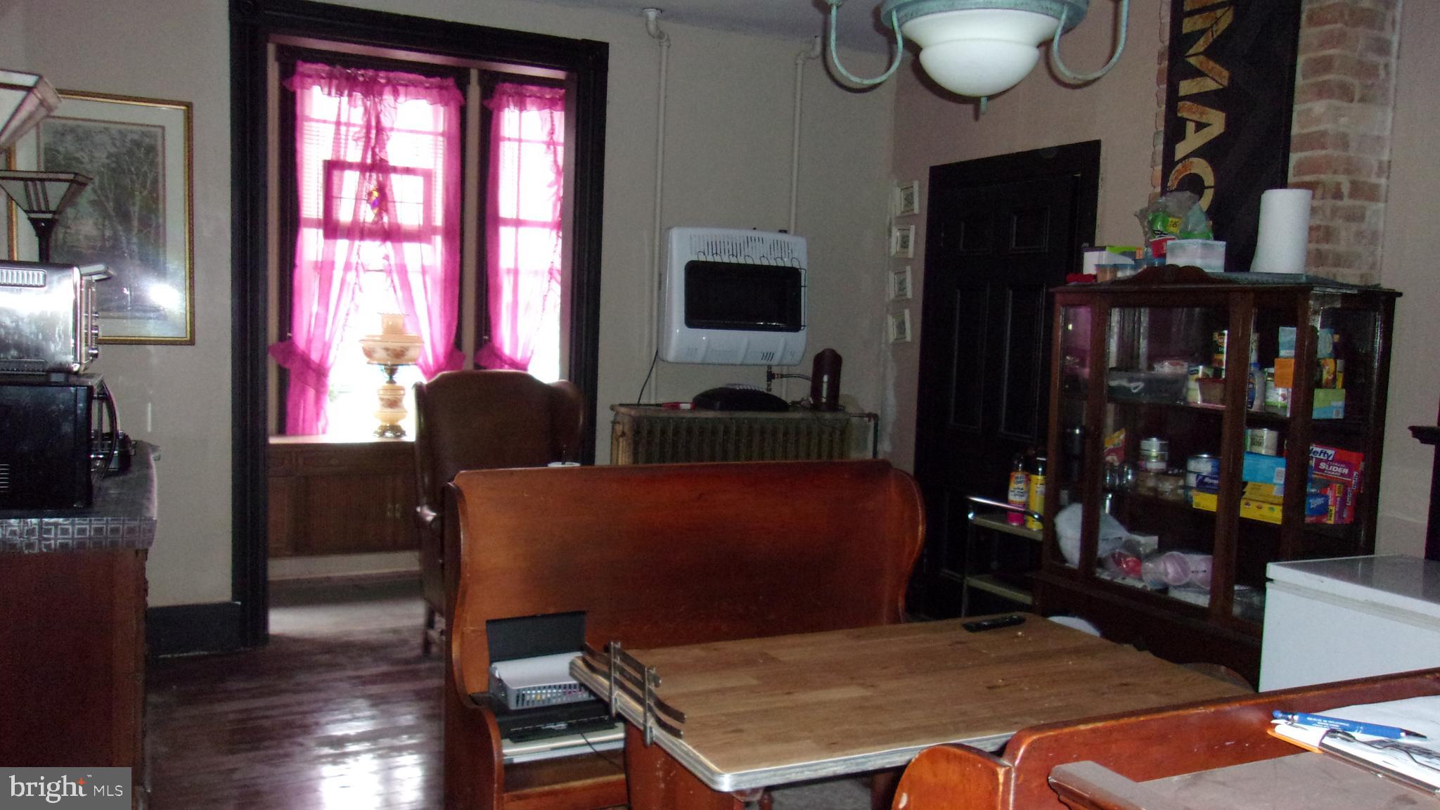 108 Knight Street Bloomington, MD 21523 - Photo 18 of 31 a room with furniture window and wooden floor