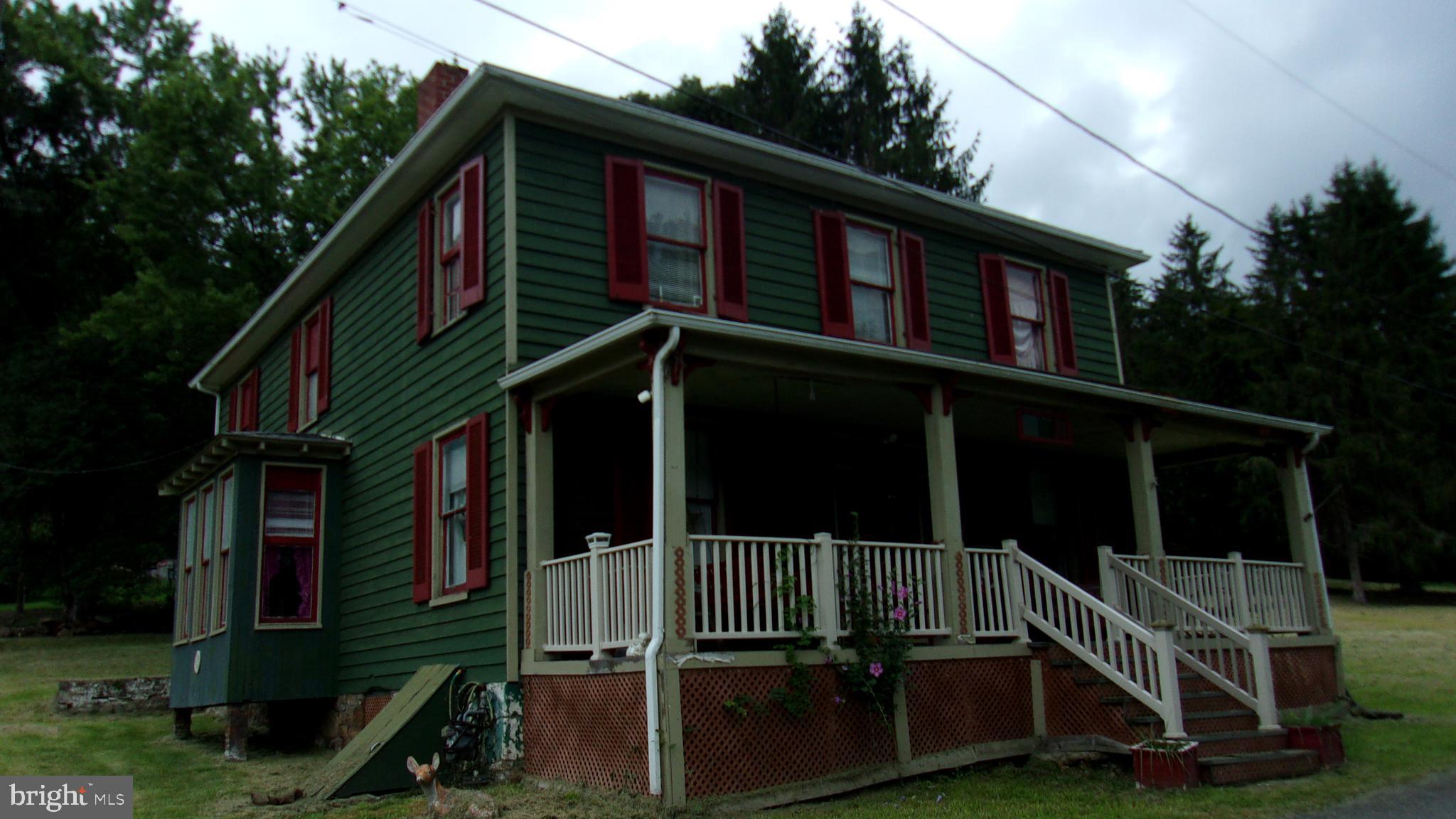 108 Knight Street Bloomington, MD 21523 - Photo 2 of 31 a view of wooden house with a small yard