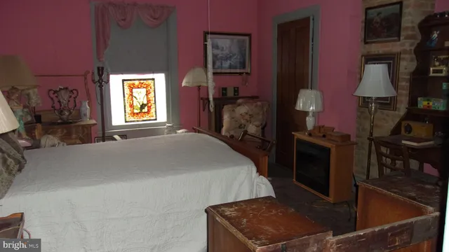 a view of a living room with furniture and a window