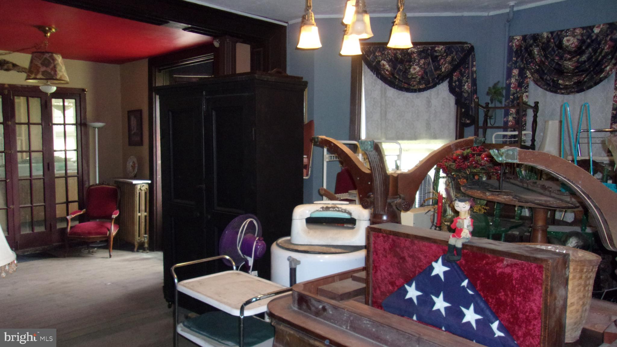 108 Knight Street Bloomington, MD 21523 - Photo 9 of 31 a living room with furniture a flat screen tv and a fireplace