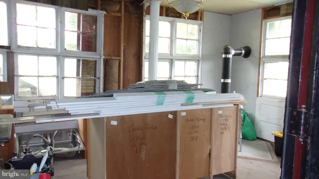 a view of living room with furniture and a window
