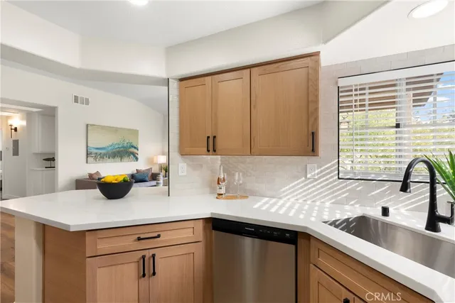 a kitchen with a sink and cabinets