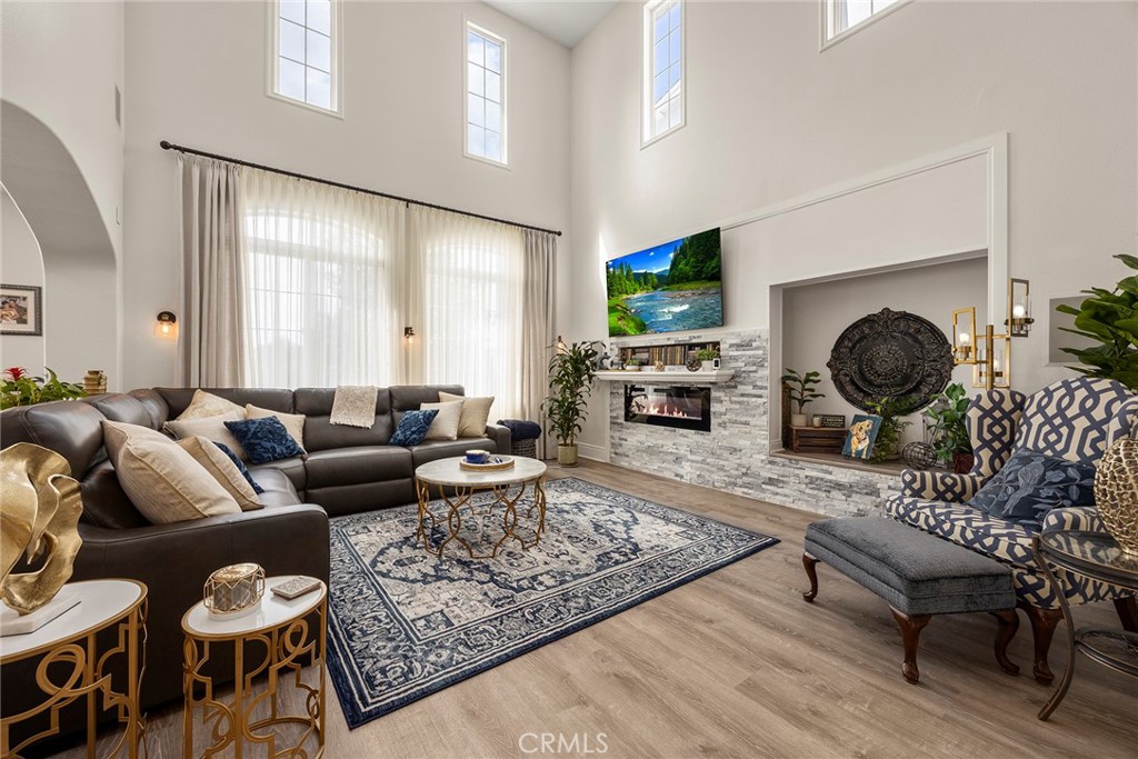 16 Kempton Lane Ladera Ranch, CA 92694 - Photo 12 of 60 Living room with fireplace. (Digitally enhanced fire).
