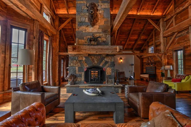 a living room with fireplace furniture and a fireplace