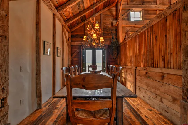 a view of balcony with two chairs and a barbeque