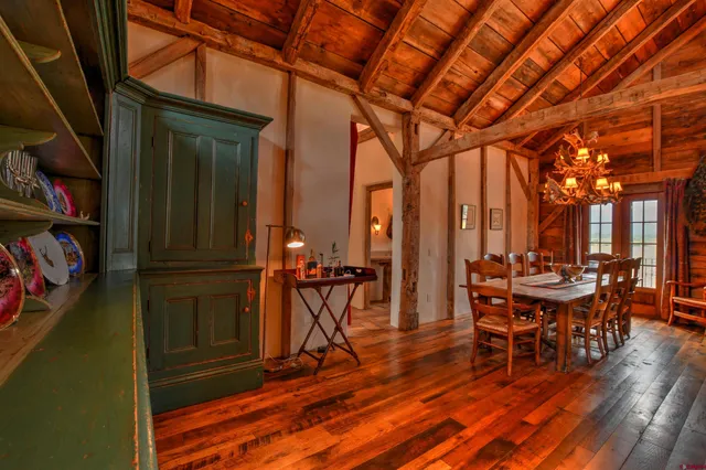 a view of a patio with table and chairs