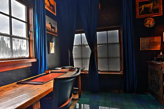 a dining room with table and chairs