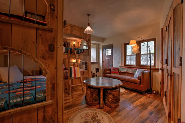 a room with a bed and furniture