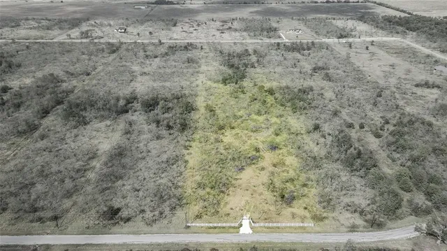 a view of a dry yard with wooden floor