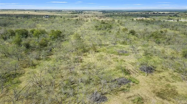a view of a field with an outdoor space