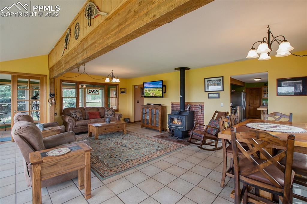 12 Ridge Drive Divide, CO 80814 - Photo 13 of 49 a living room with furniture a dining table and chairs with wooden floor