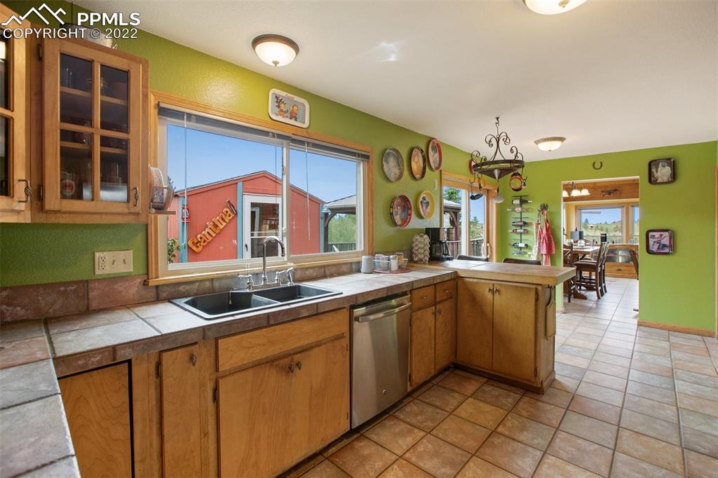 12 Ridge Drive Divide, CO 80814 - Photo 17 of 49 a kitchen with stainless steel appliances granite countertop a sink and a cabinets