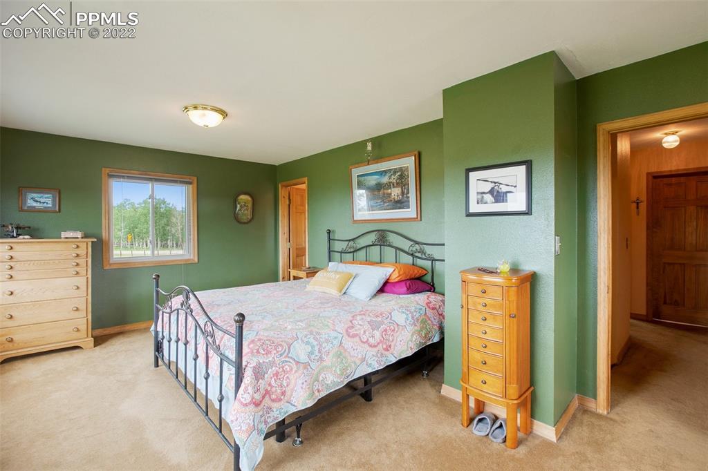 12 Ridge Drive Divide, CO 80814 - Photo 21 of 49 a bedroom with a bed and a dresser