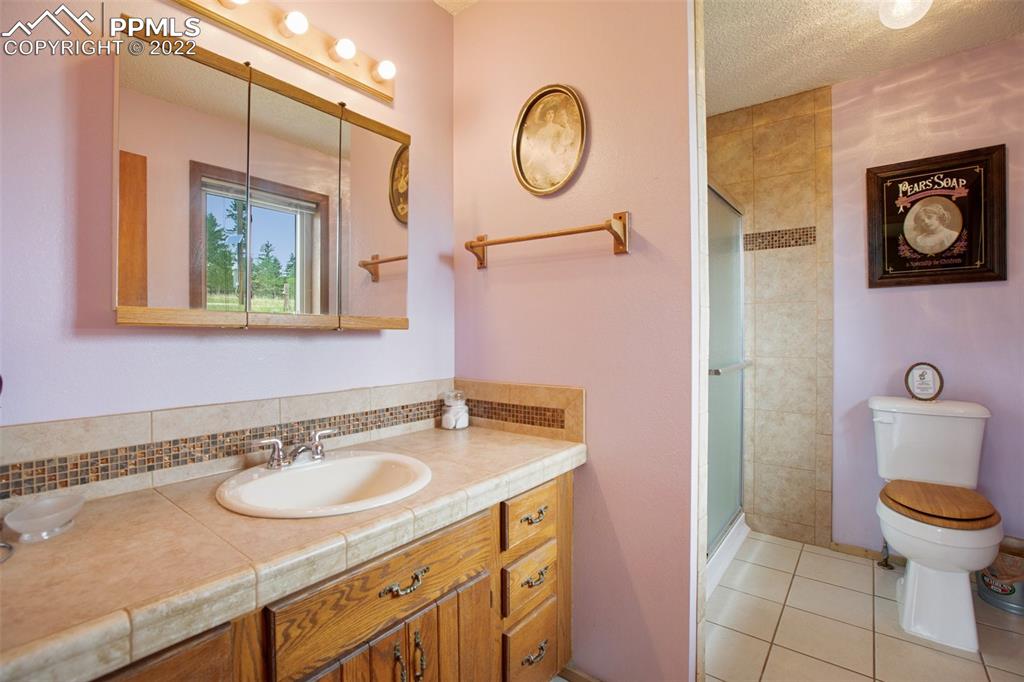 12 Ridge Drive Divide, CO 80814 - Photo 34 of 49 a bathroom with a sink and a mirror