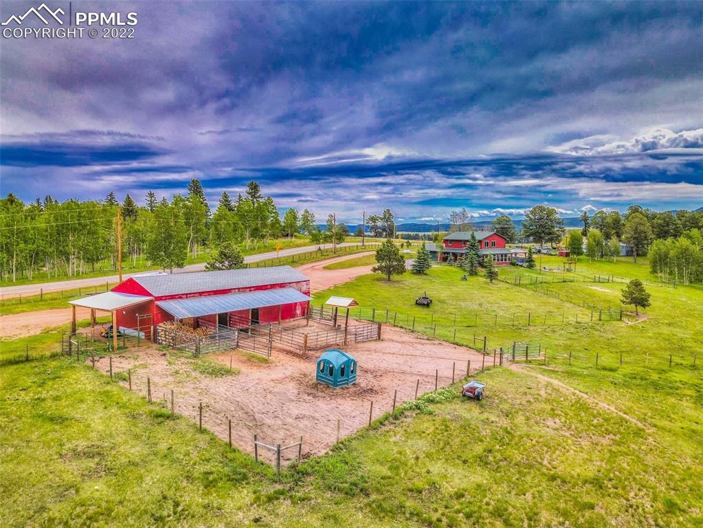 12 Ridge Drive Divide, CO 80814 - Photo 4 of 49 a view of a swimming pool with a table and chairs in patio