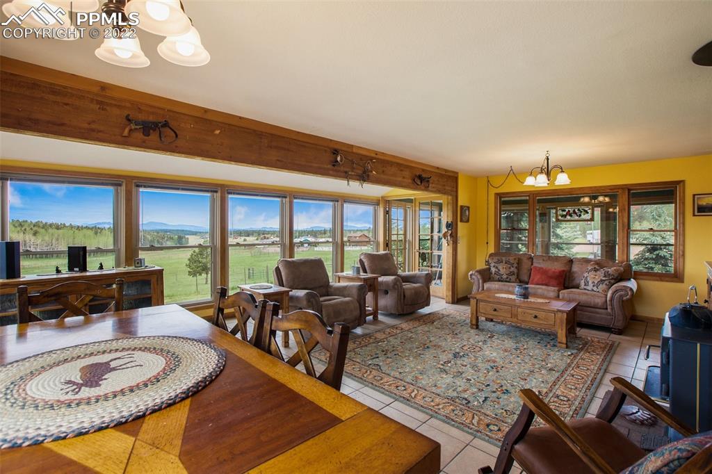 12 Ridge Drive Divide, CO 80814 - Photo 10 of 49 a living room with furniture a large window and a table
