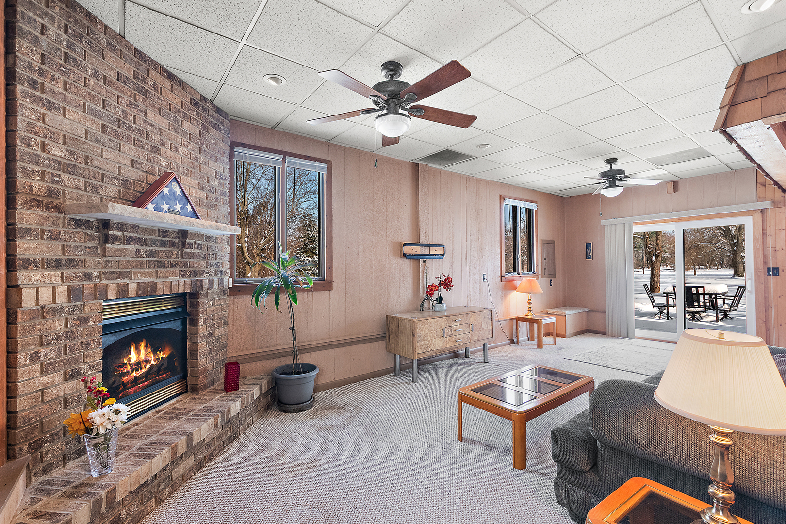 10705 Lane Street Crown Point, IN 46307 - Photo 11 of 36 a living room with furniture a flat screen tv and a fireplace