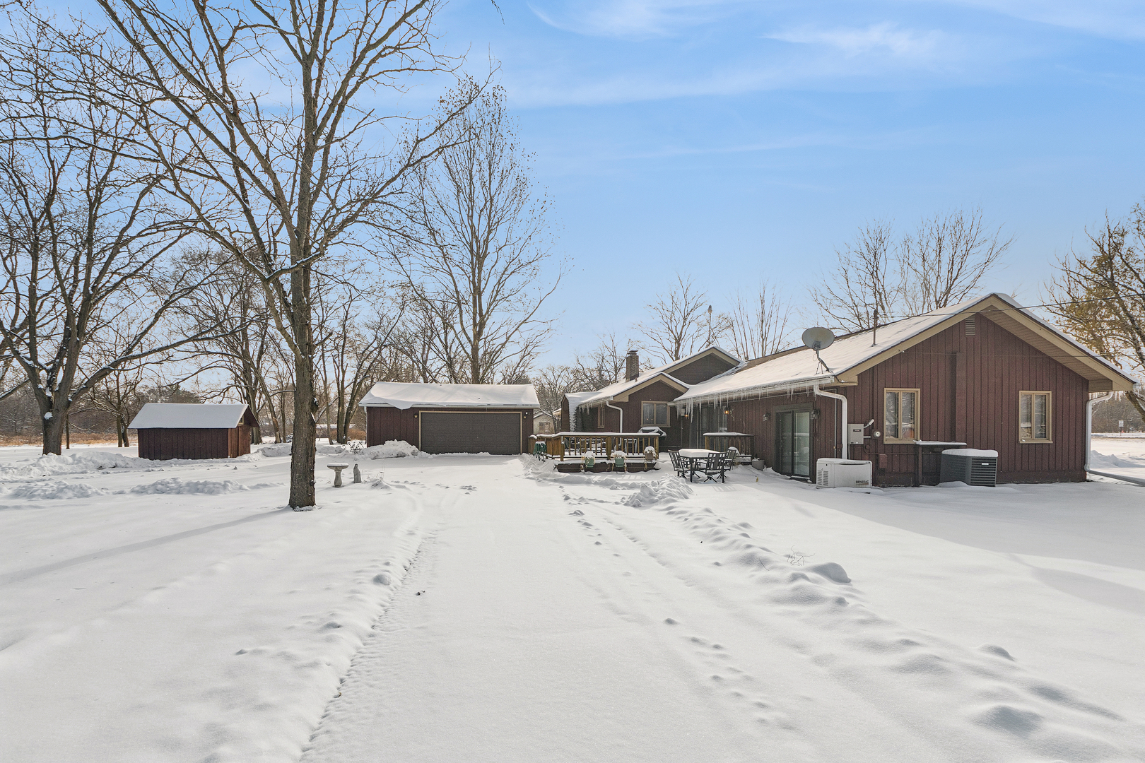 10705 Lane Street Crown Point, IN 46307 - Photo 21 of 36 a view of a house with a yard covered in snow