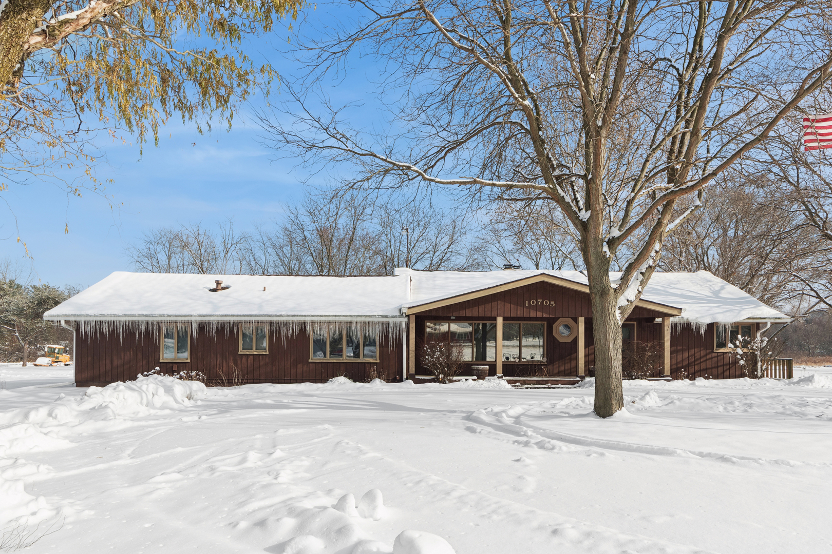 10705 Lane Street Crown Point, IN 46307 - Photo 22 of 36 a front view of a house with a yard