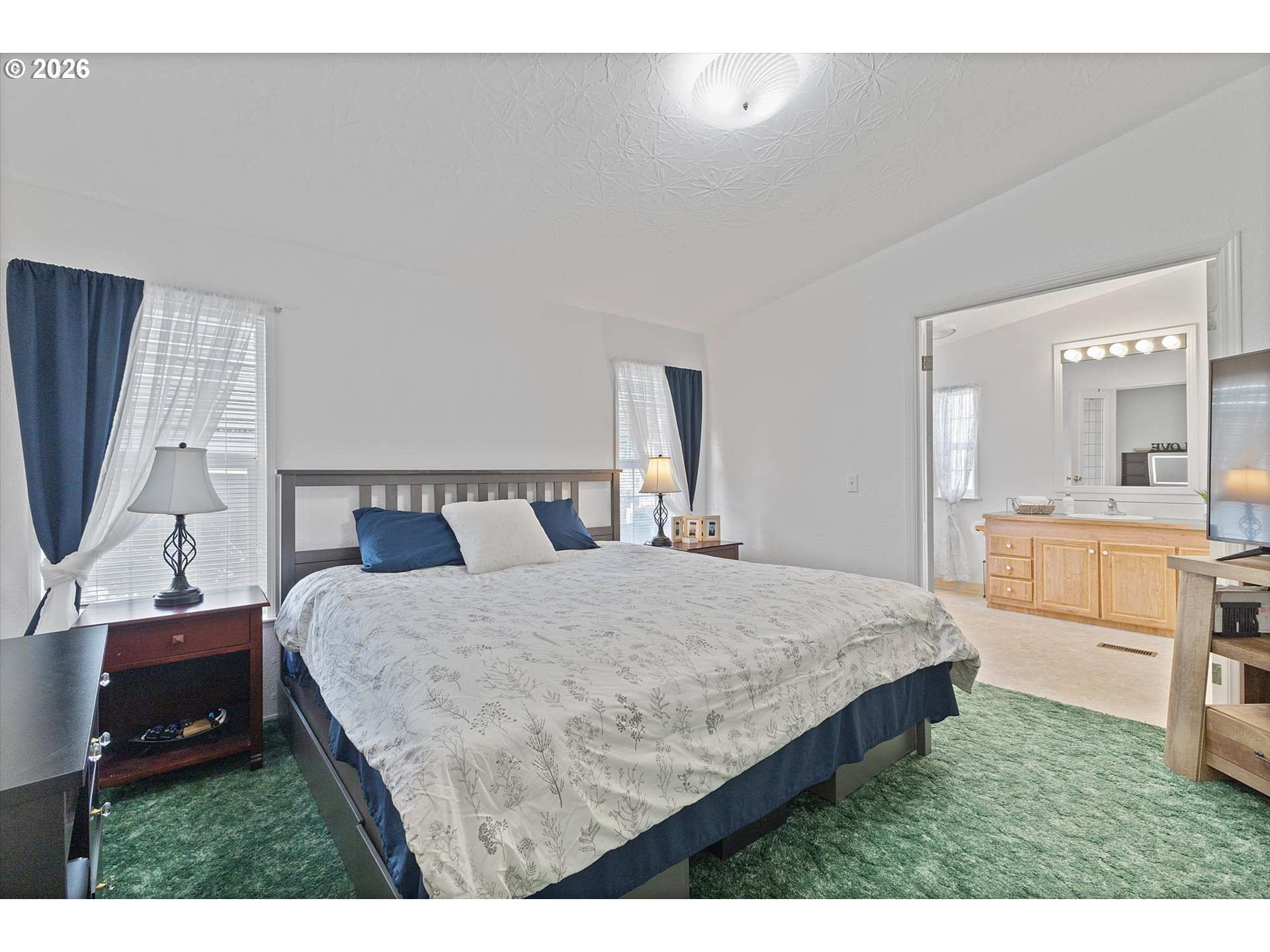 32935 Southwest Oakview Court Cornelius, OR 97113 - Photo 20 of 47 a bedroom with a bed and a flat screen tv