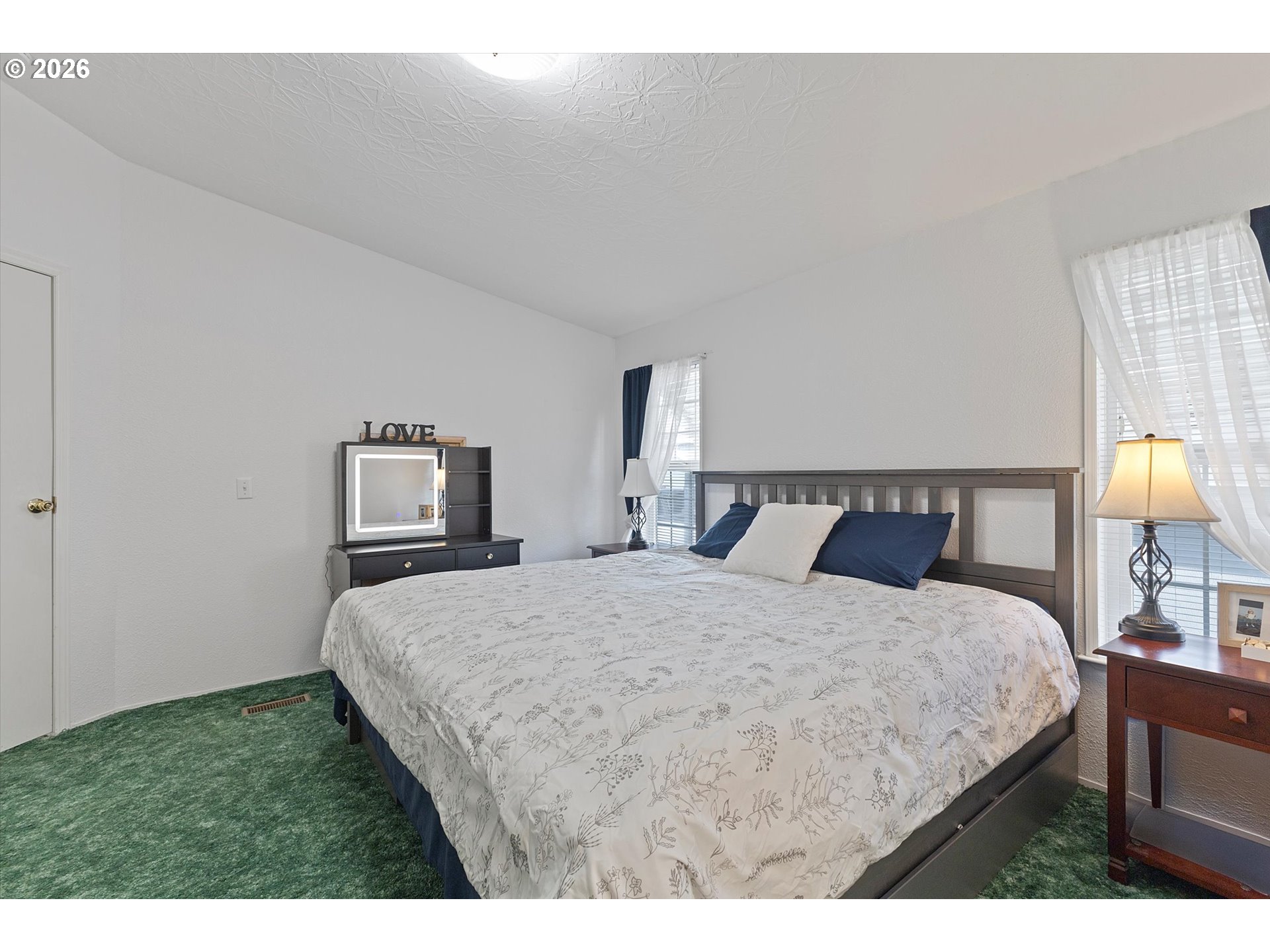 32935 Southwest Oakview Court Cornelius, OR 97113 - Photo 22 of 47 a bedroom with a bed a lamp and a dresser