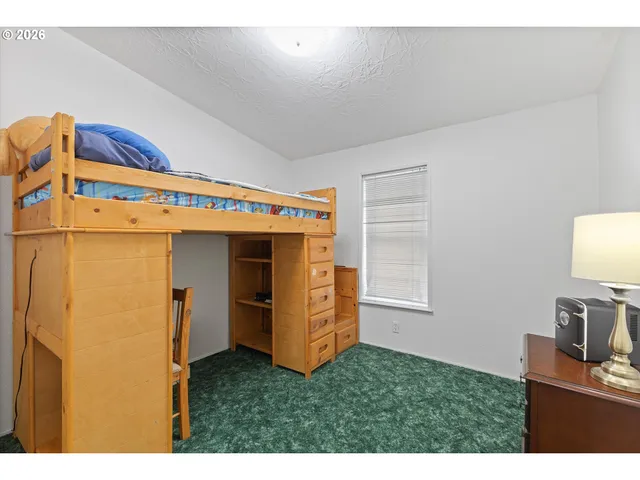 a kitchen with stainless steel appliances a refrigerator and a stove