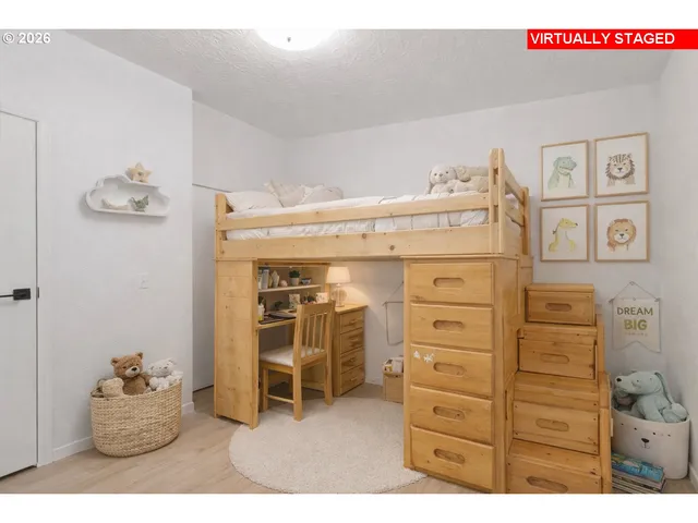 a bedroom with a bed and a cabinets