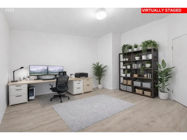 a workspace with furniture and window