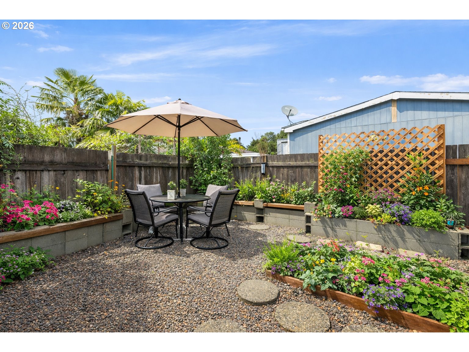 32935 Southwest Oakview Court Cornelius, OR 97113 - Photo 41 of 47 a view of a patio with table and chairs under an umbrella