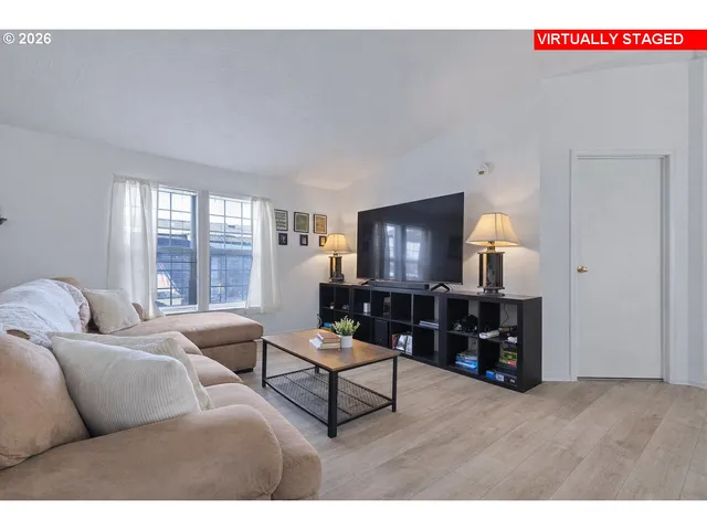 a living room with furniture and a window