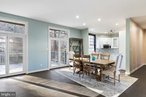 a view of an empty room with a window and fireplace