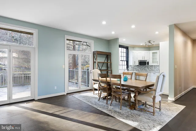 a view of an empty room with a window and fireplace