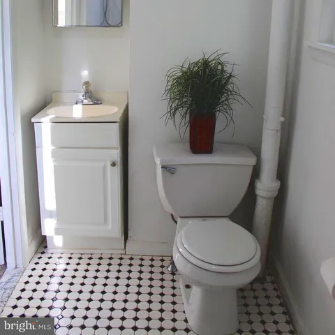 a bathroom with a toilet and a sink