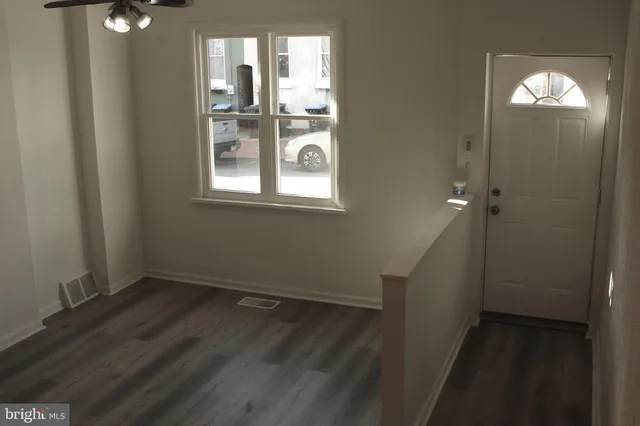 an empty room that has a window in it