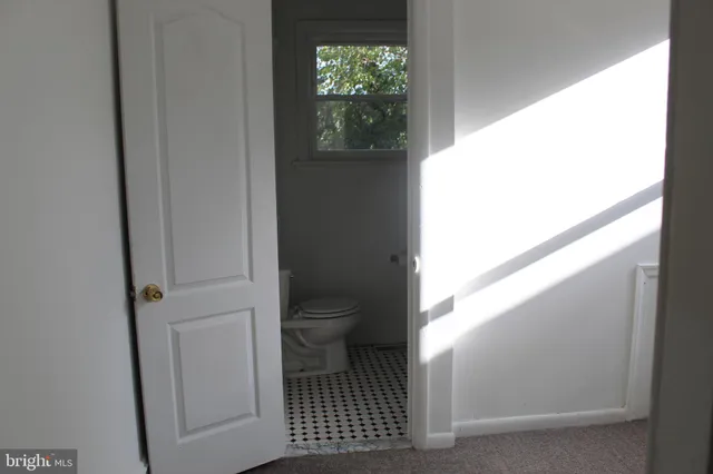 a view of a door and chair in the balcony